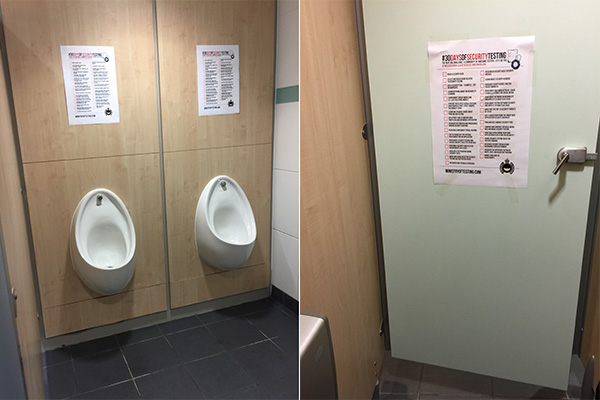 Posters placed above a urinal and in a bathroom stall